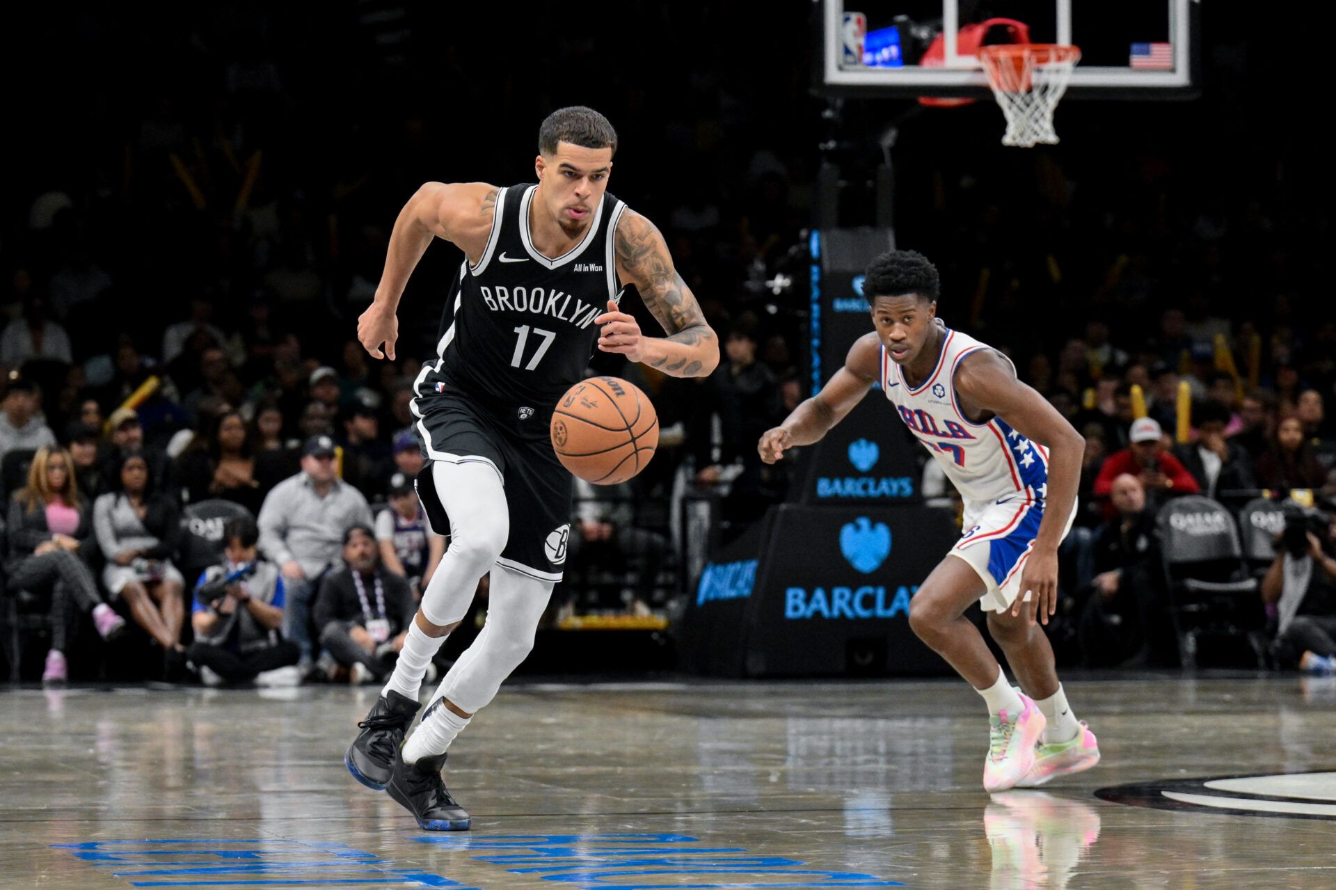 Brooklyn Nets forward Michael Porter Jr. (17) leads a fast break as Philadelphia 76ers guard VJ Edgecombe (77) pursues during the second half at Barclays Center.