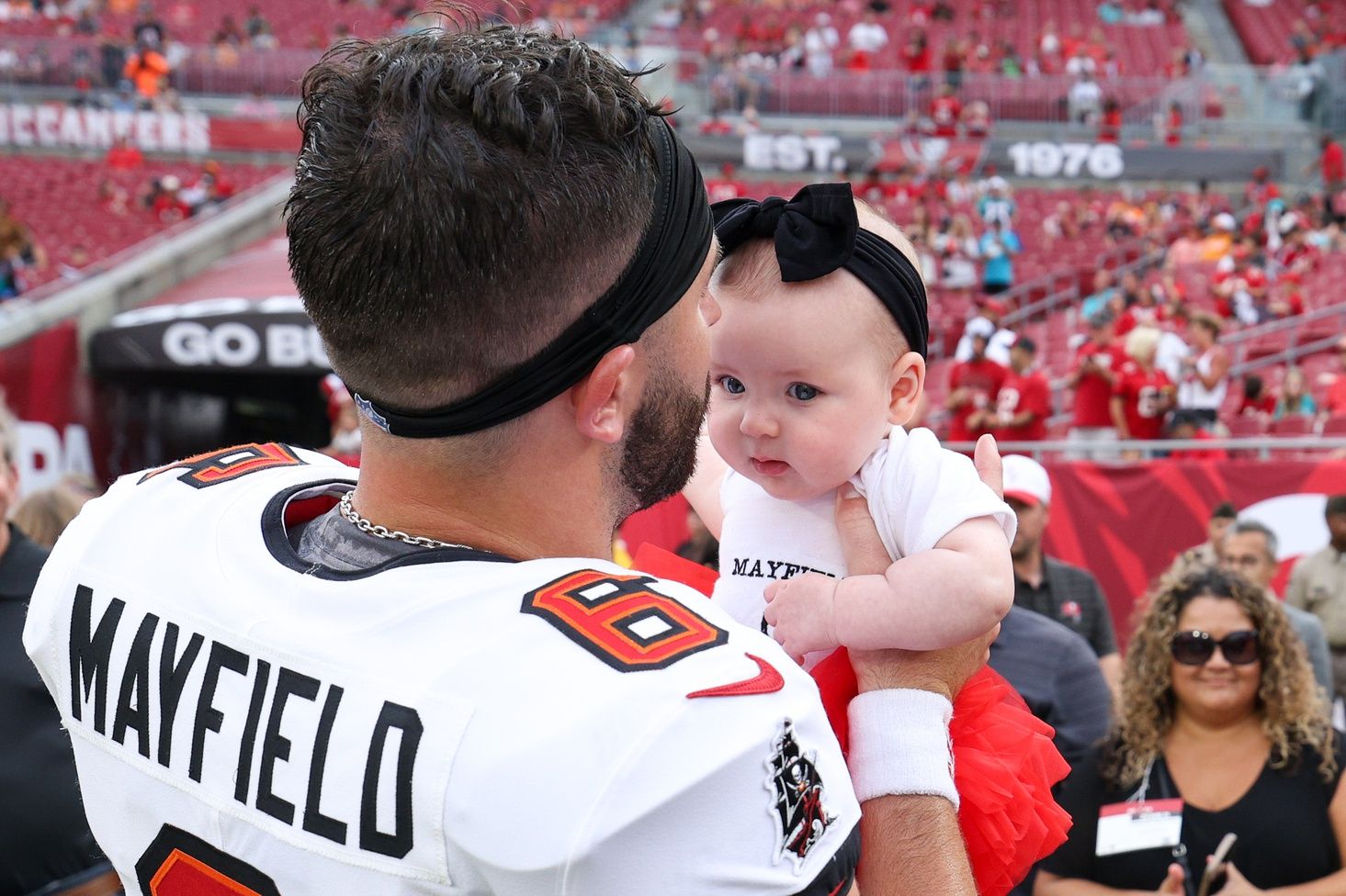 Tampa Bay Buccaneers quarterback Baker Mayfield (6) greets his family before a preseason game against the Miami Dolphins at Raymond James Stadium.