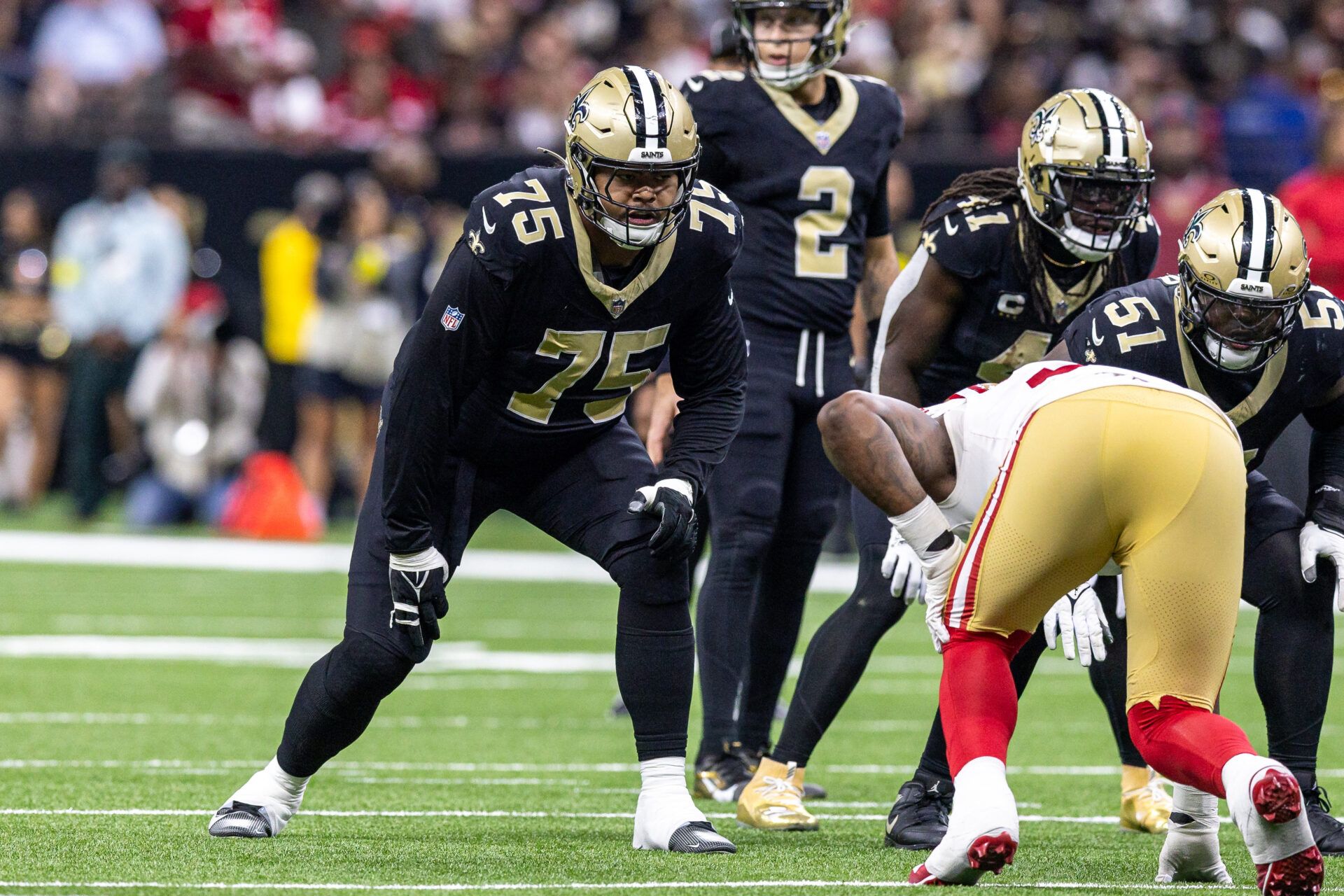 New Orleans Saints offensive tackle Taliese Fuaga (75) blocks against the San Francisco 49ers during the second half at Caesars Superdome.