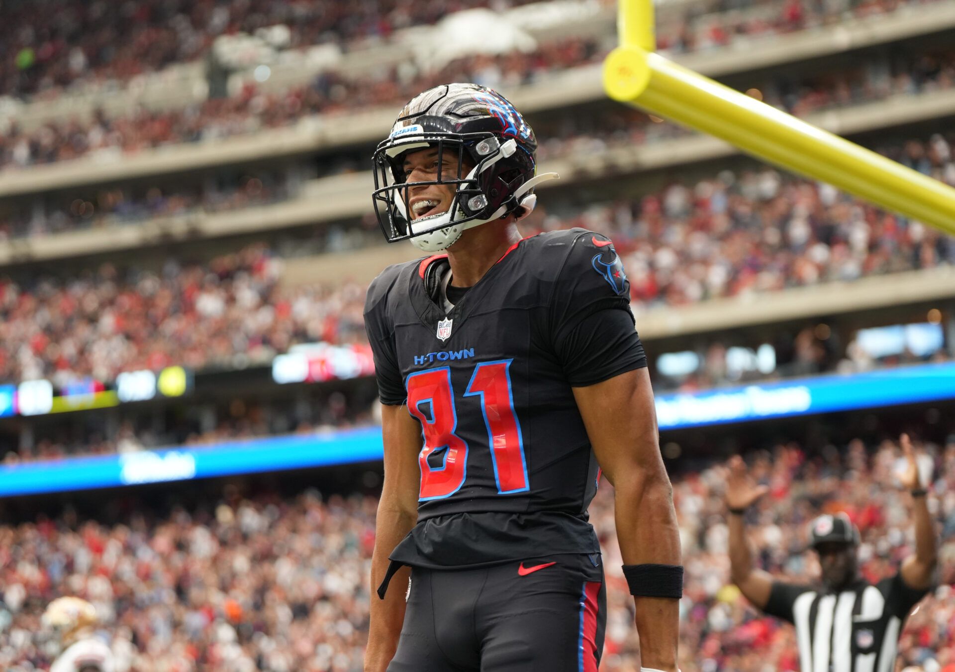 Houston Texans wide receiver Jayden Higgins (81) reacts after catching a pass for a touchdown during the second quarter against the San Francisco 49ers at NRG Stadium.