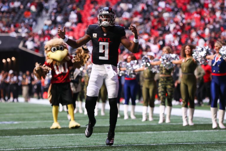Atlanta Falcons quarterback Michael Penix Jr. (9) enters the field before the game against the Carolina Panthers at Mercedes-Benz Stadium.