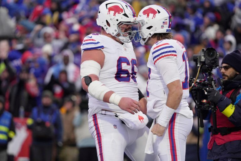 Buffalo Bills guard Connor McGovern and quarterback Josh Allen celebrate in the end zone Allen’s third touchdown during second half action against the Tampa Bay Buccaneers on Nov 16, 2025 at Highmark Stadium in Orchard Park.