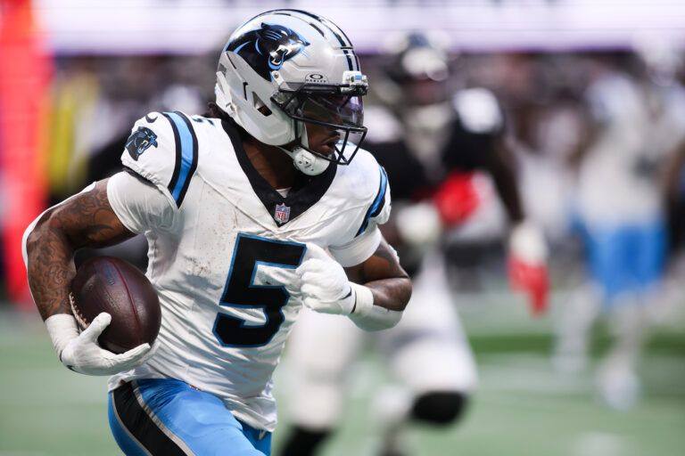 Carolina Panthers running back Rico Dowdle (5) runs with the ball in the third quarter against the Carolina Panthers at Mercedes-Benz Stadium.