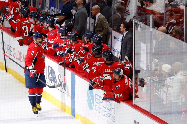 Washington Capitals left wing Alex Ovechkin (8) celebrates with teammates after scoring a goal against the Edmonton Oilers during the first period at Capital One Arena.