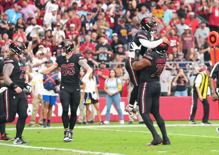Arizona Cardinals quarterback Kyler Murray (1) celebrates his touchdown run with offensive tackle Paris Johnson Jr. (70) during the first quarter against the Tennessee Titans at State Farm Stadium.
