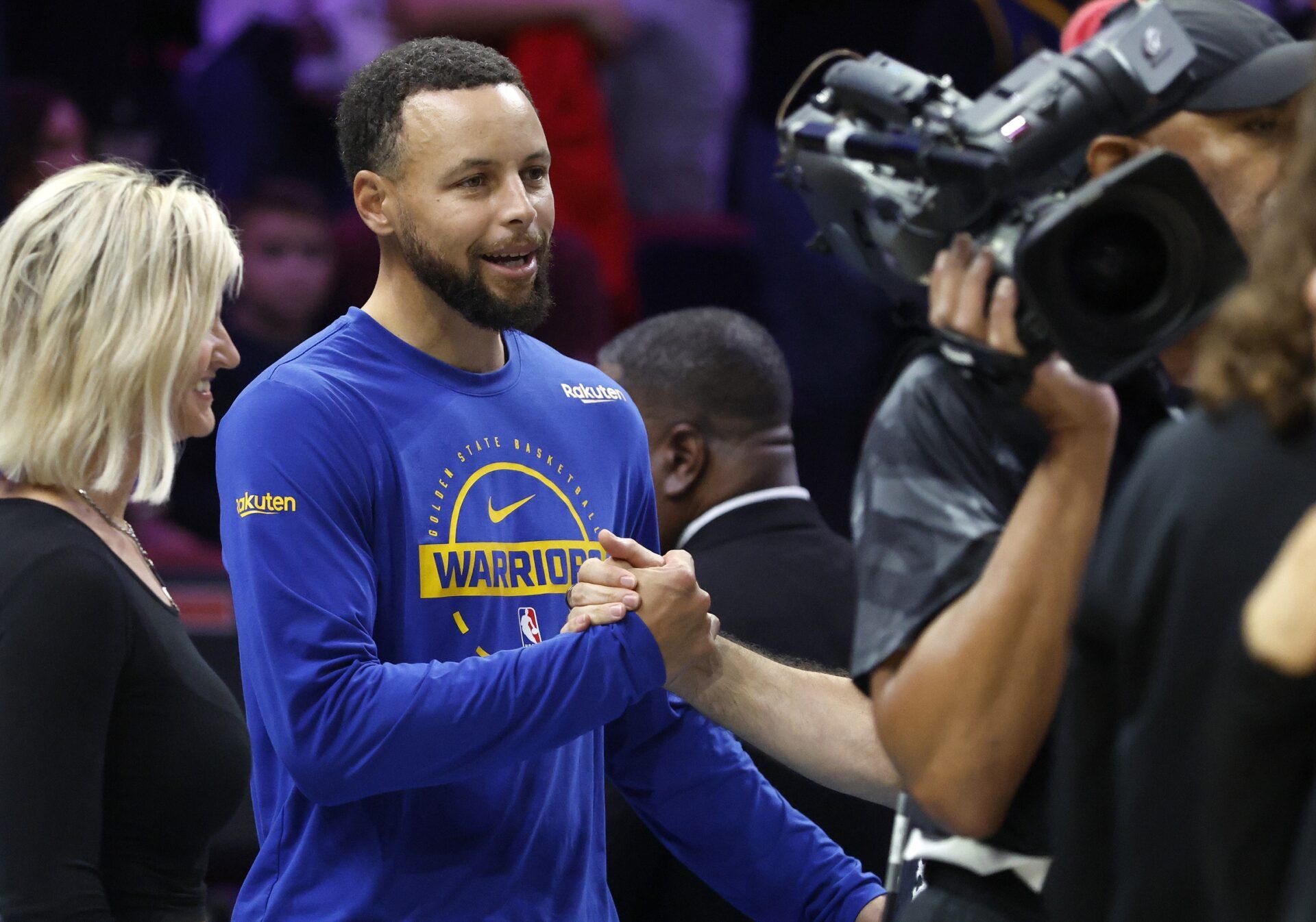 Golden State Warriors guard Stephen Curry (30) greets fans before the game against the Miami Heat at Kaseya Center.
