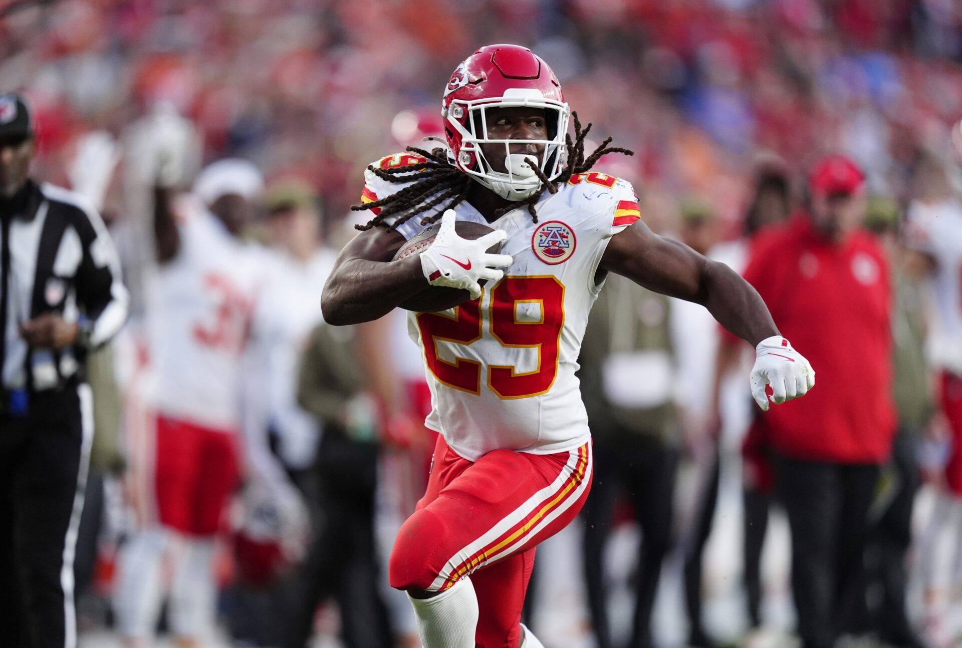 Kansas City Chiefs running back Kareem Hunt (29) carries the ball in the third quarter against the Denver Broncos at Empower Field at Mile High.