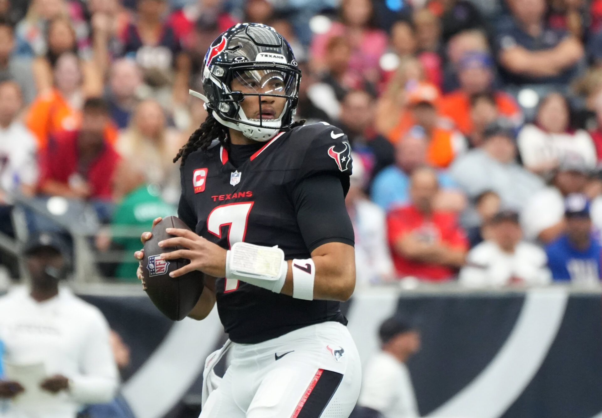 Houston Texans quarterback C.J. Stroud (7) drops to throw during the first half against the Denver Broncos at NRG Stadium.