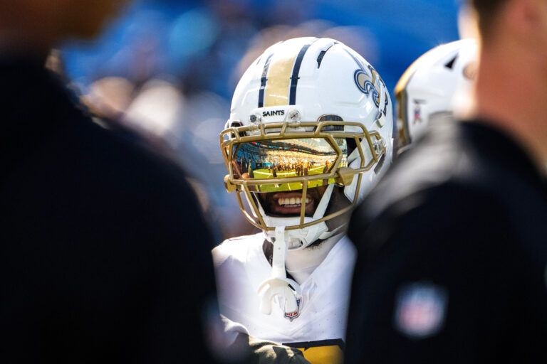 New Orleans Saints wide receiver Chris Olave (12) on the field before the game at Bank of America Stadium.