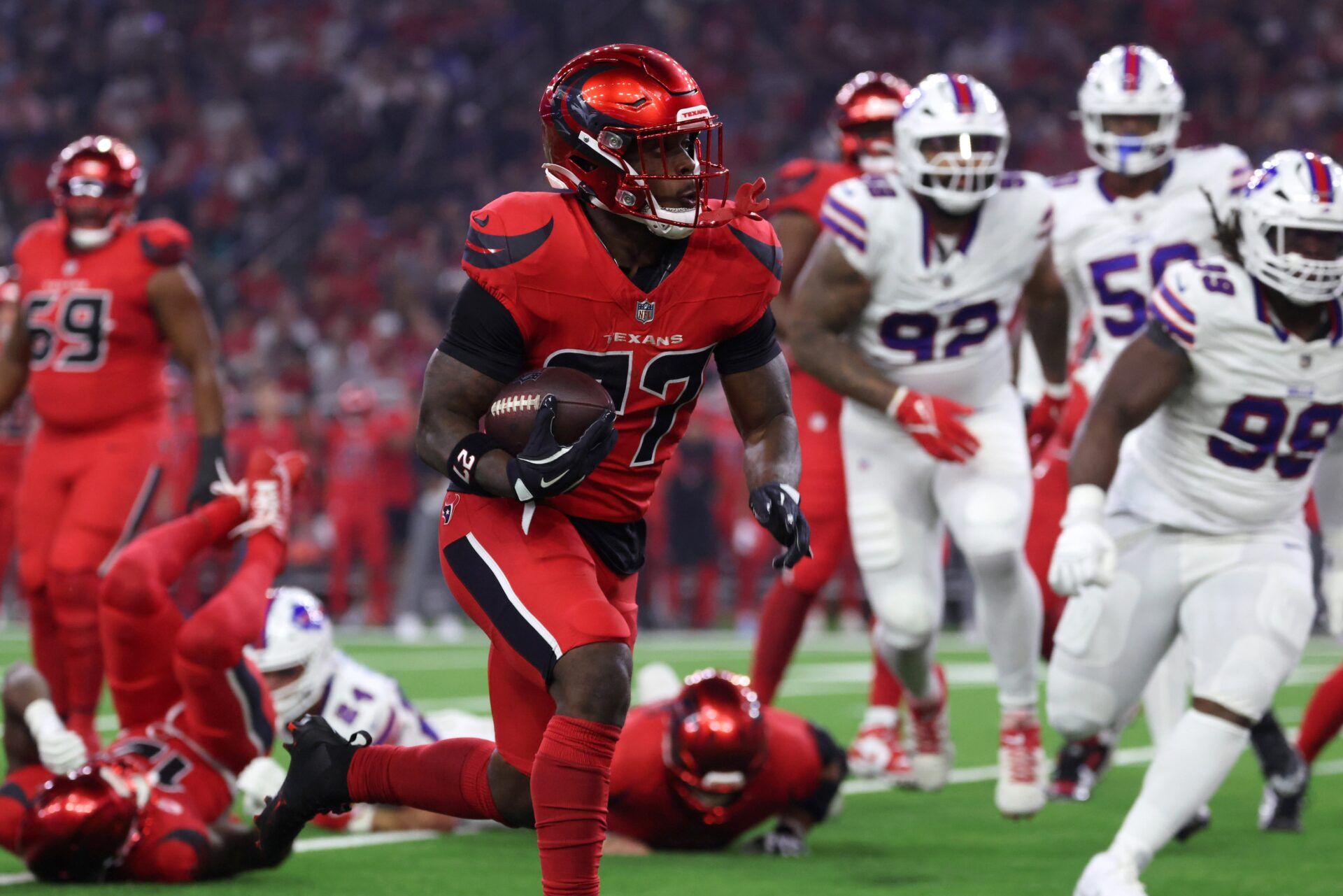 Houston Texans running back Woody Marks (27) runs against the Buffalo Bills in the first quarter at NRG Stadium.