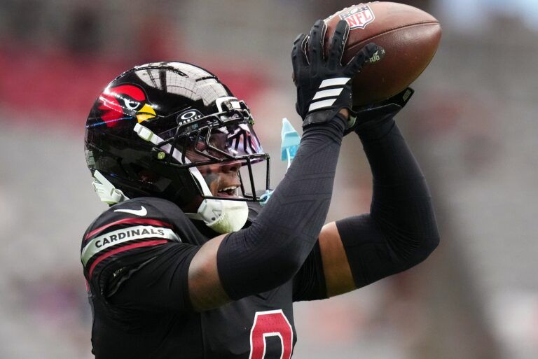 Arizona Cardinals cornerback Will Johnson (0) catches a pass during warmups before their game against the Tennessee Titans at State Farm Stadium in Glendale on Oct. 5, 2025.