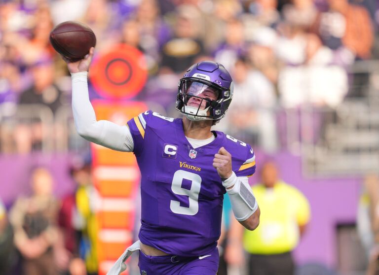 Minnesota Vikings quarterback J.J. McCarthy (9) throws downfield during the first quarter against the Chicago Bears at U.S. Bank Stadium.
