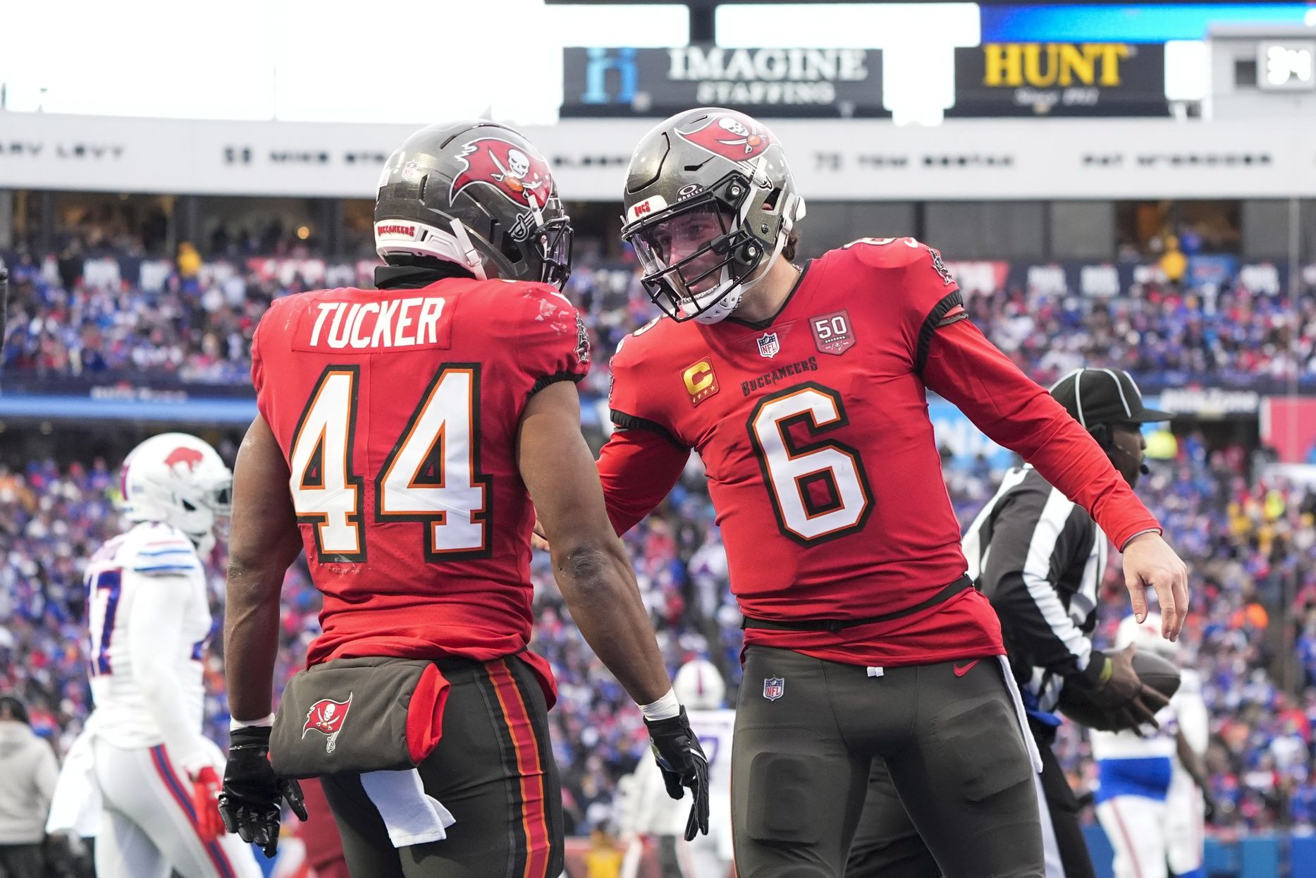 Tampa Bay Buccaneers running back Sean Tucker (44) celebrates a touchdown against the Buffalo Bills with quarterback Baker Mayfield (6) during the second half of the game at Highmark Stadium.