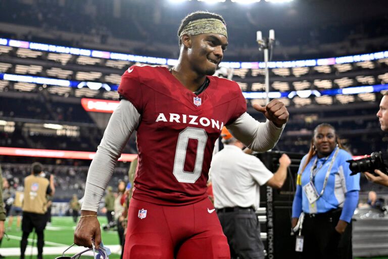 Arizona Cardinals cornerback Will Johnson (0) celebrates as he leaves the field after defeating the Dallas Cowboys at AT&T Stadium.