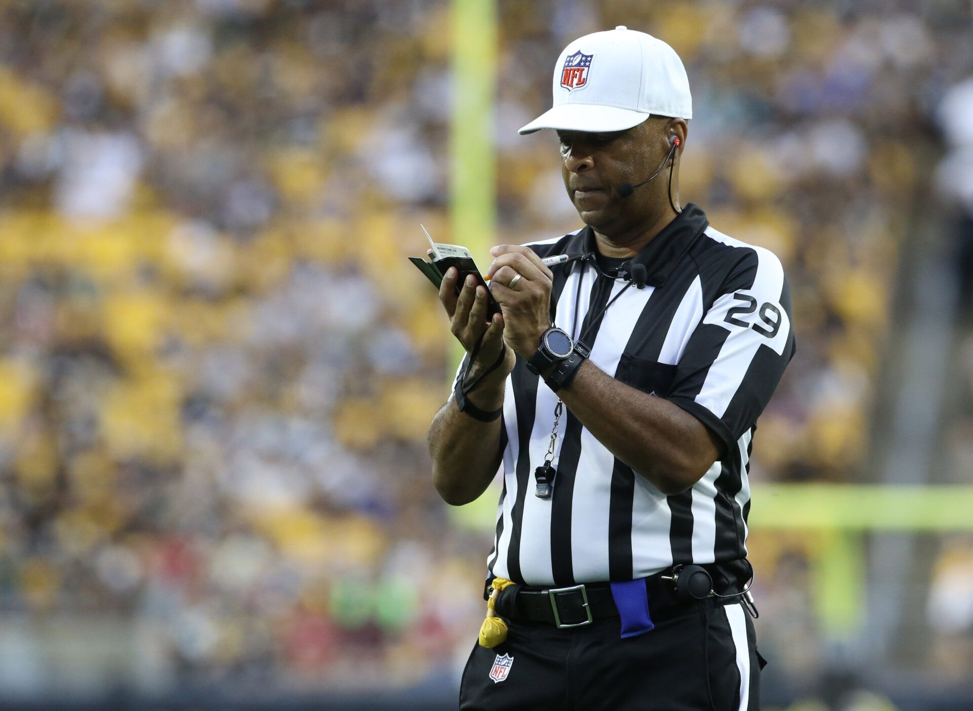 NFL referee Adrian Hill (29) makes a note during the game between the Seattle Seahawks and the Pittsburgh Steelers in the second quarter at Acrisure Stadium.
