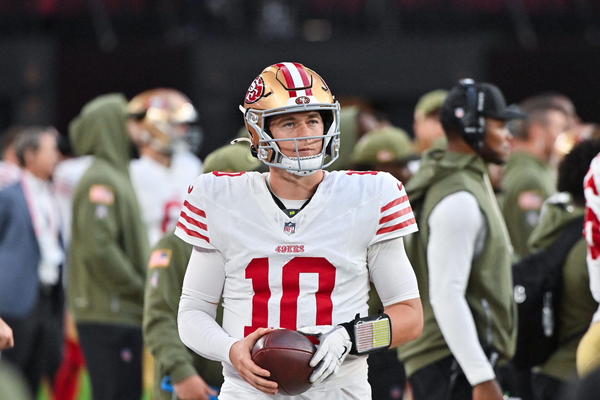 San Francisco 49ers quarterback Mac Jones (10) looks on in the second half against the Arizona Cardinals at State Farm Stadium.
