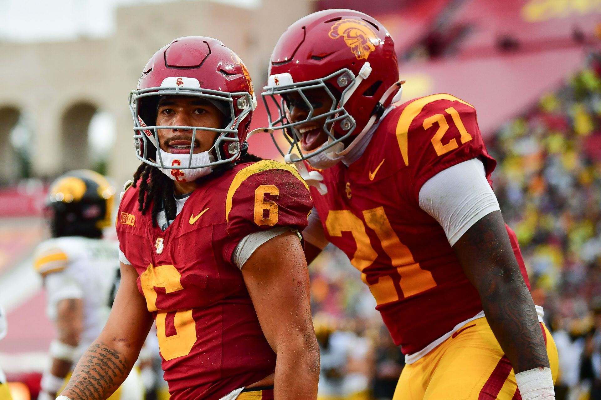 Southern California Trojans wide receiver Makai Lemon (6) celebrates his touchdown scored against the Iowa Hawkeyes with running back Bryan Jackson (21) during the second half at the Los Angeles Memorial Coliseum.