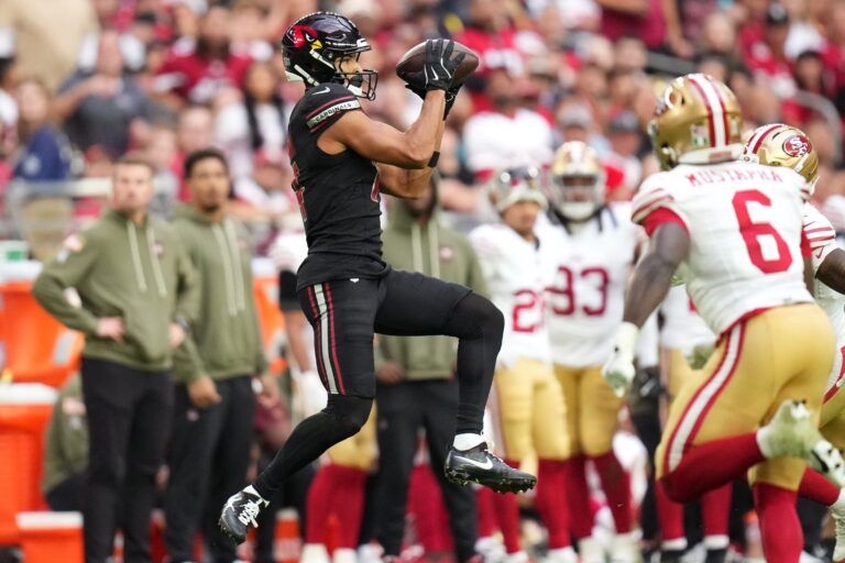 Arizona Cardinals receiver Michael Wilson (14) catches a pass against the San Francisco 49ers at State Farm Stadium in Glendale on Nov. 16, 2025.