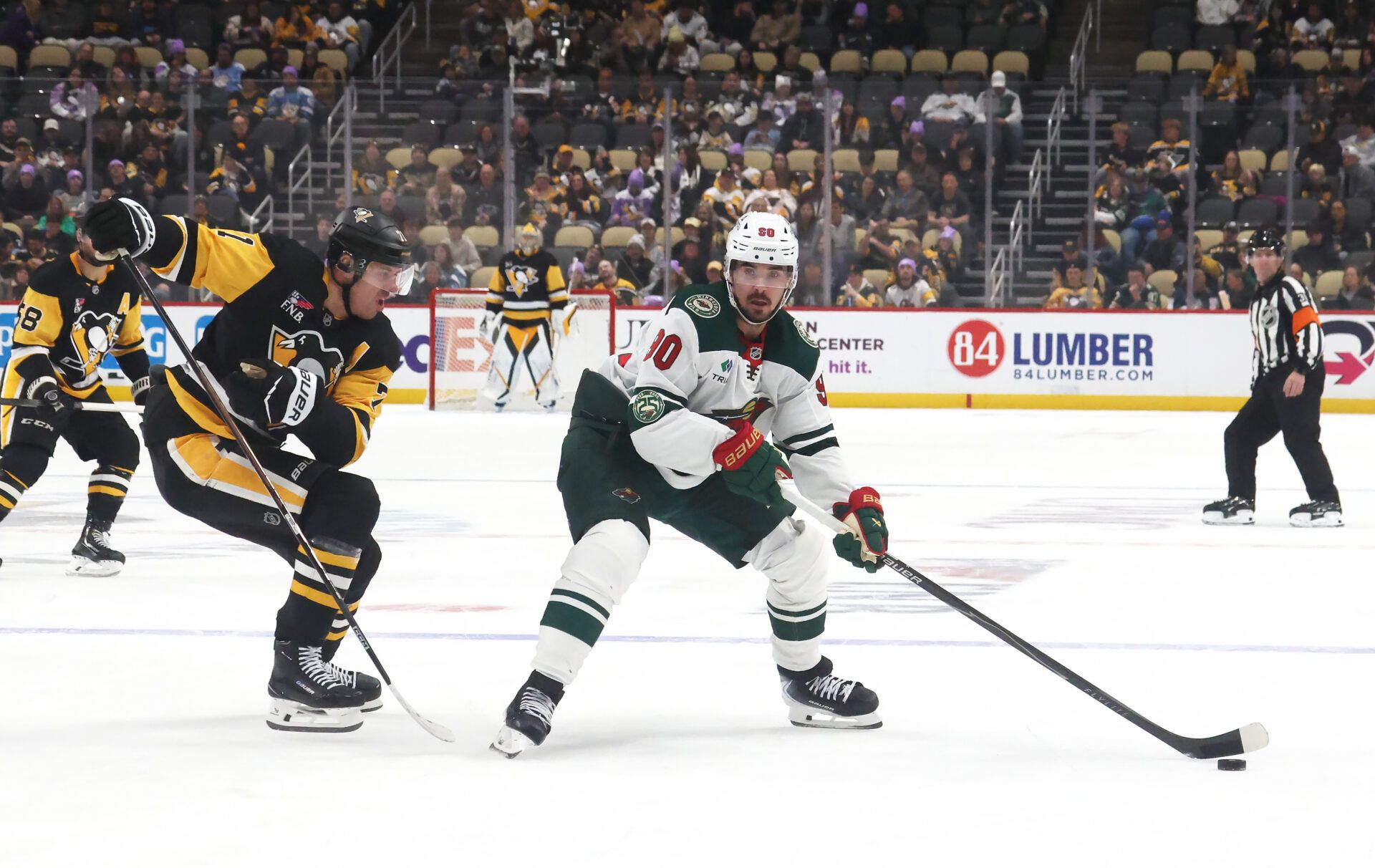 Minnesota Wild left wing Marcus Johansson (90) handles the puck against Pittsburgh Penguins center Evgeni Malkin (71) during the third period at PPG Paints Arena.