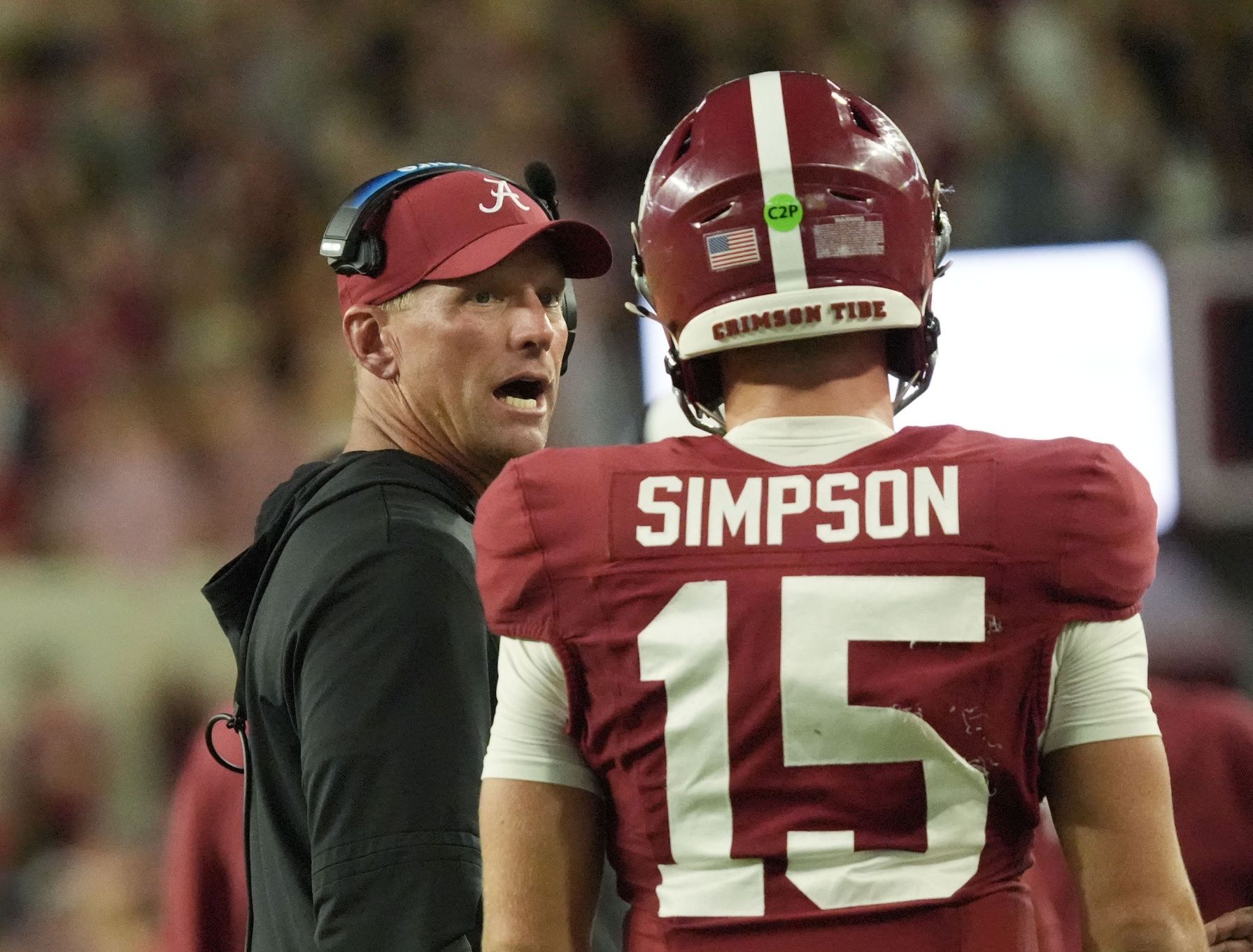 Alabama head coach Kalen DeBoer talks to Alabama quarterback Ty Simpson (15) as Simpson comes off the field after a touchdown drive against UL Monroe at Saban Field at Bryant-Denny Stadium.
