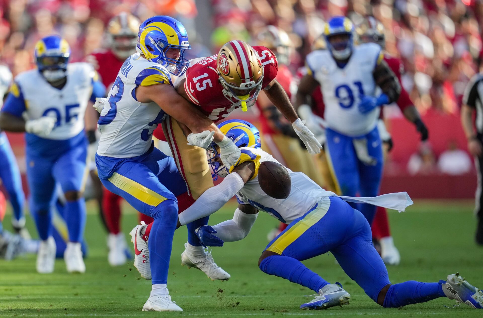 Los Angeles Rams linebacker Nate Landman (53) forces a fumble from San Francisco 49ers wide receiver Jauan Jennings (15) during the first quarter at Levi's Stadium.