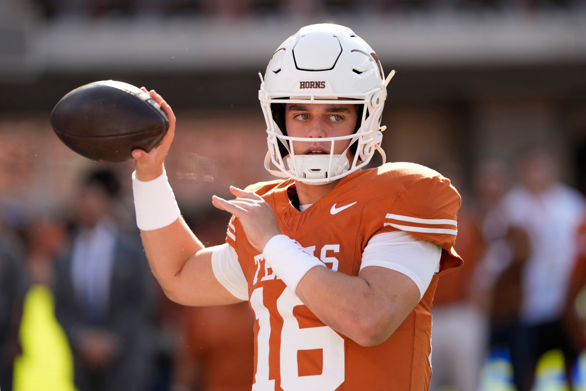 Texas Longhorns quarterback Arch Manning (16) warms up before a game against the Arkansas Razorbacks at Darrell K Royal-Texas Memorial Stadium.