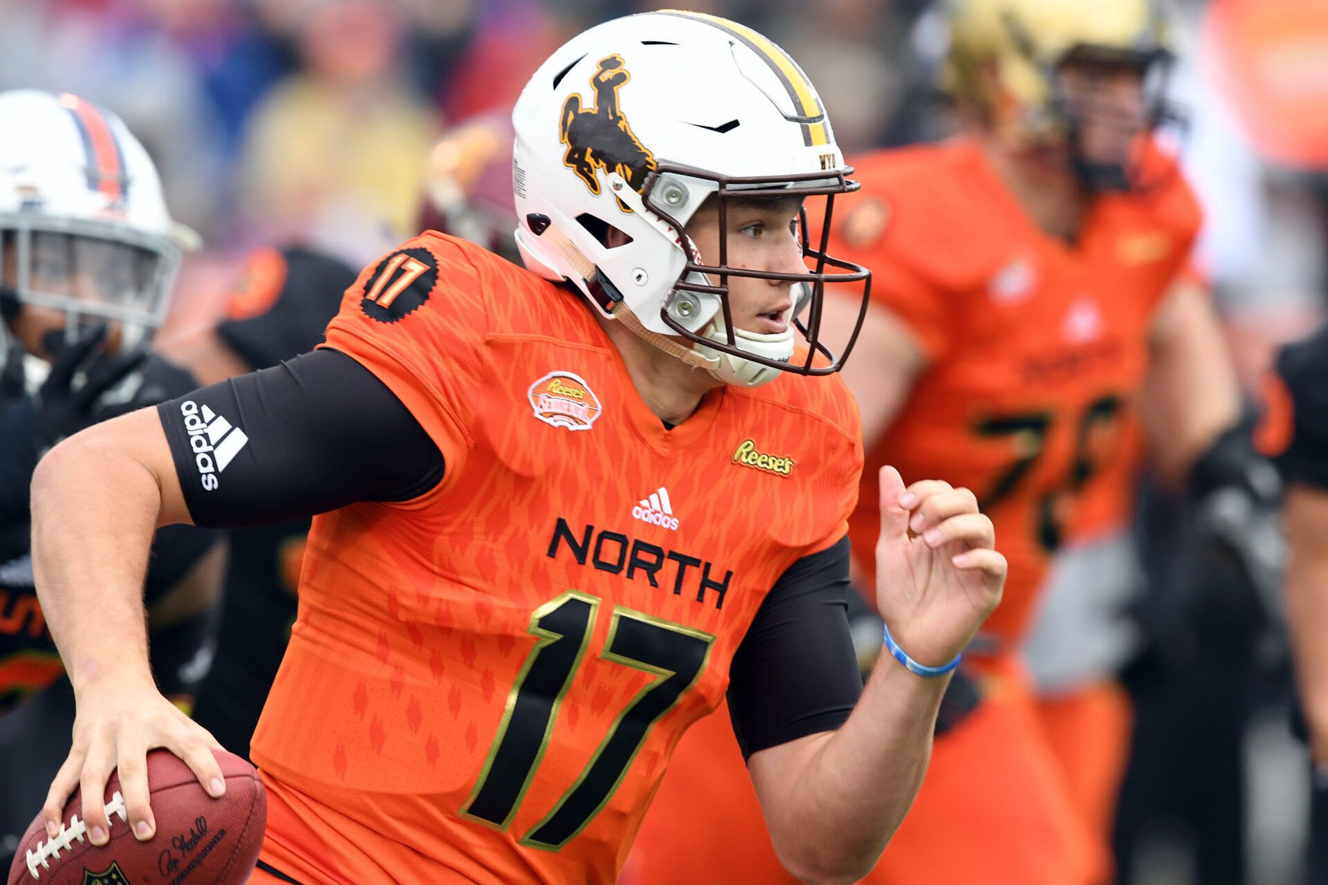 North squad quarterback Josh Allen of Wyoming (17) scrambles out of the pocket against the South squad during the first quarter at the 2018 Senior Bowl at Ladd-Peebles Stadium.