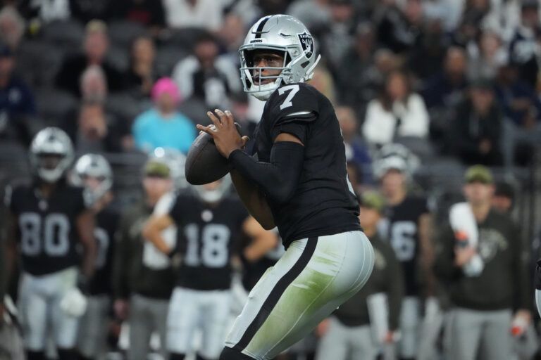 Las Vegas Raiders quarterback Geno Smith (7) looks to pass downfield against the Dallas Cowboys during the second half at Allegiant Stadium.
