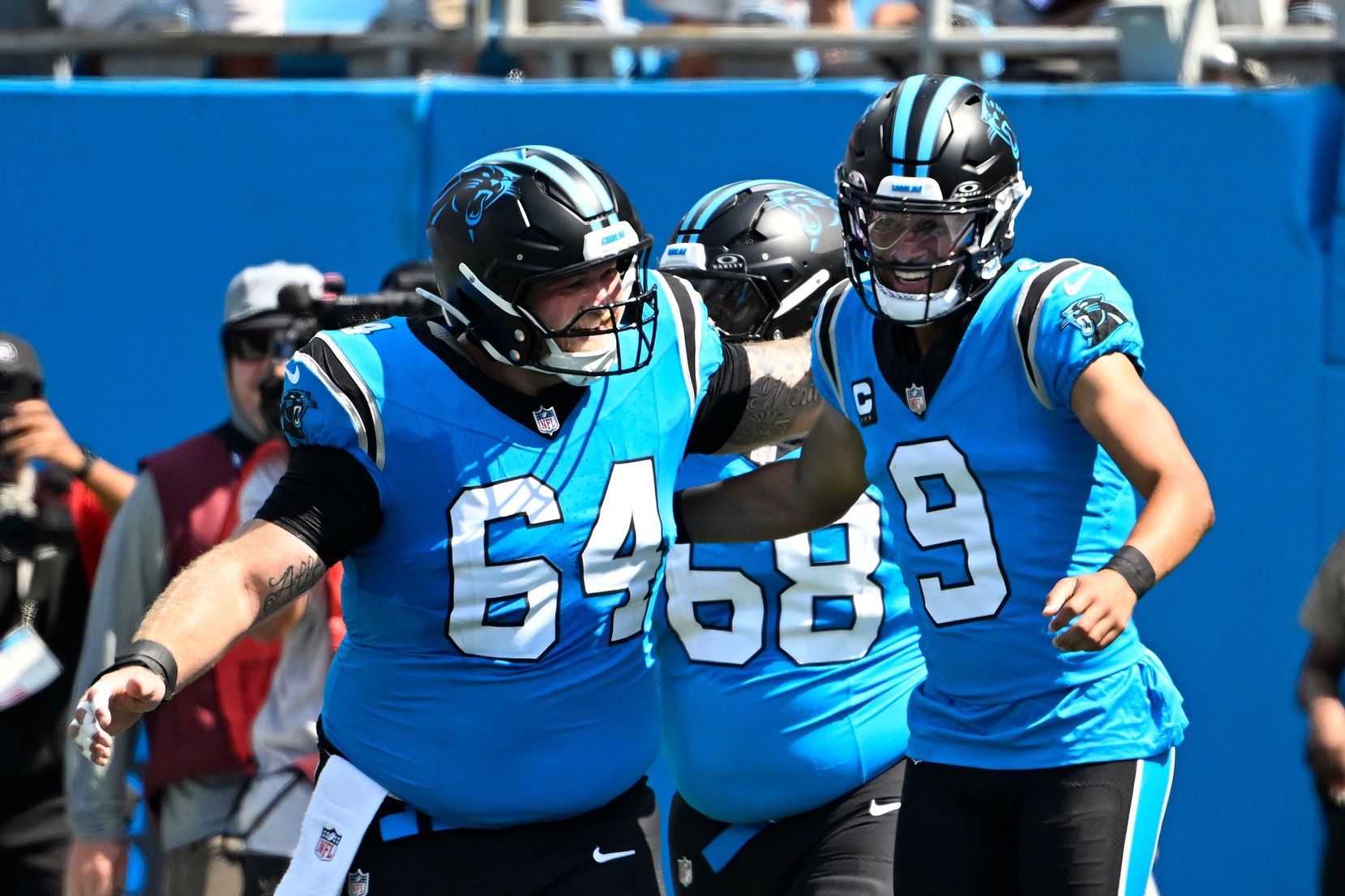 Carolina Panthers quarterback Bryce Young (9) celebrates with center Cade Mays (64) after scoring a touchdown in the first quarter at Bank of America Stadium.