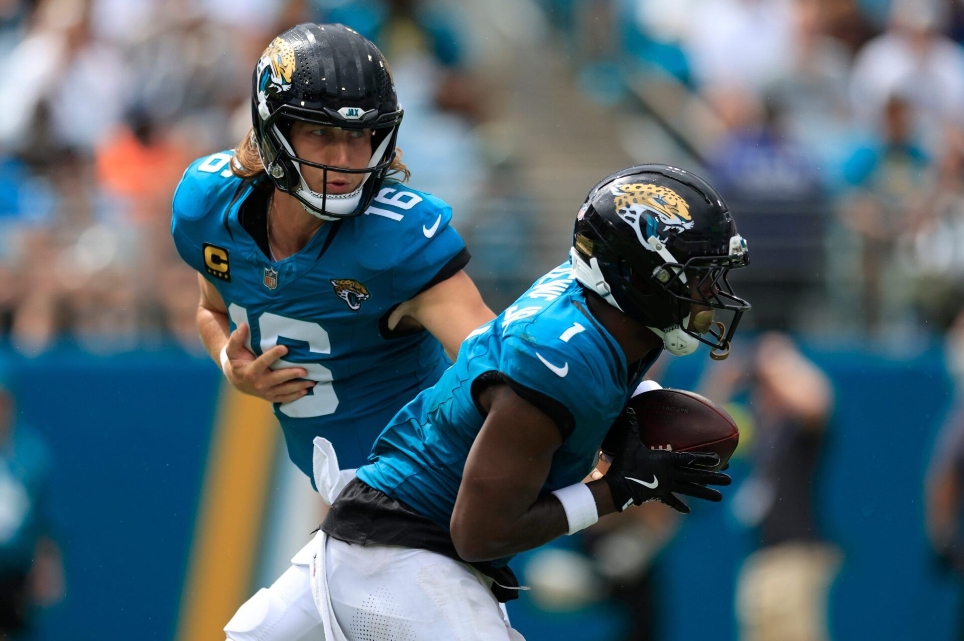 Jacksonville Jaguars quarterback Trevor Lawrence (16) hands off to Jacksonville Jaguars running back Travis Etienne Jr. (1) during the second quarter of an NFL football matchup at EverBank Stadium, Sunday, Sept. 7, 2025 in Jacksonville, Fla. [Corey Perrine/Florida Times-Union]