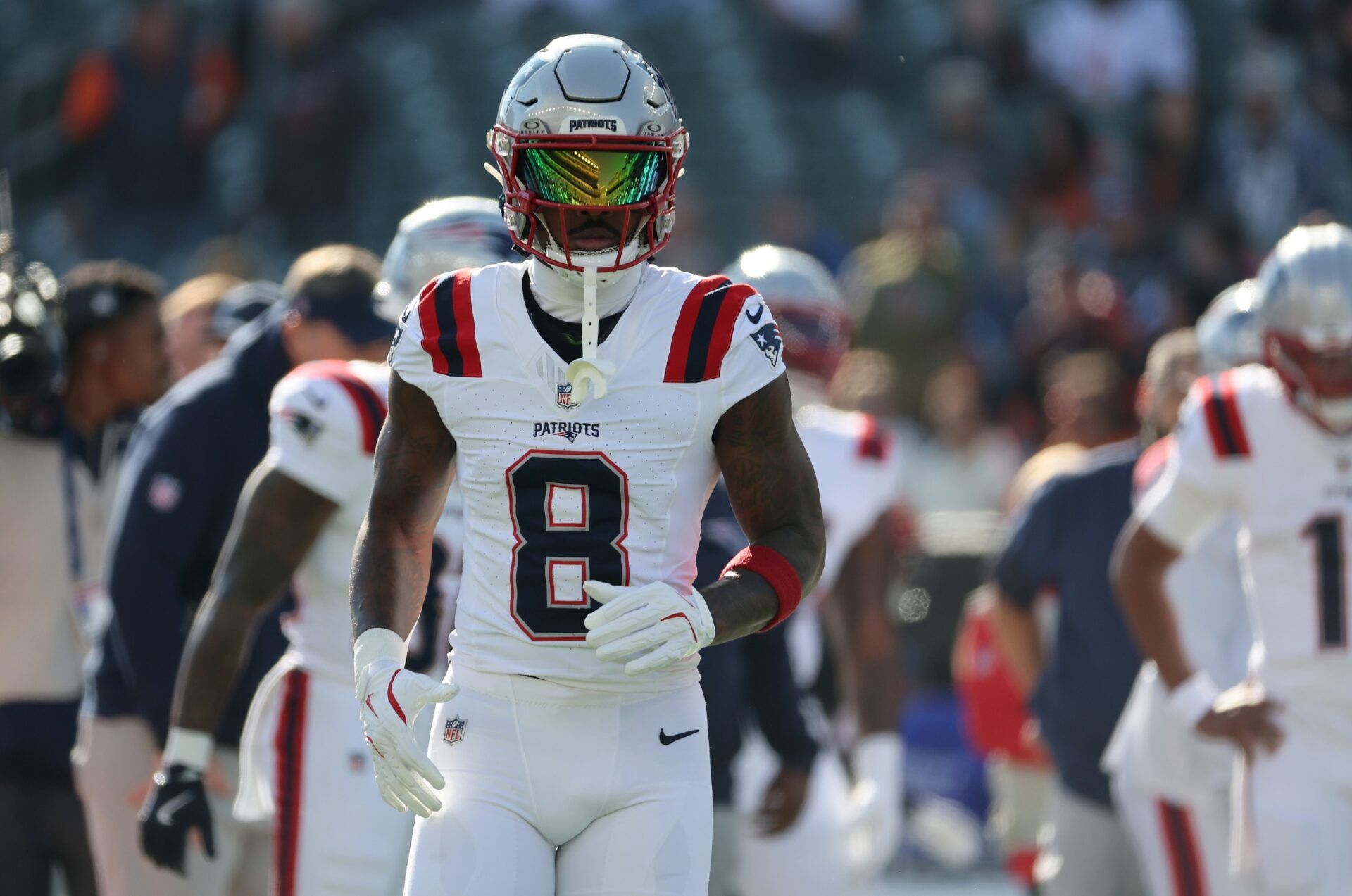 New England Patriots wide receiver Stefon Diggs (8) warms up before a game against the Cincinnati Bengals at Paycor Stadium.