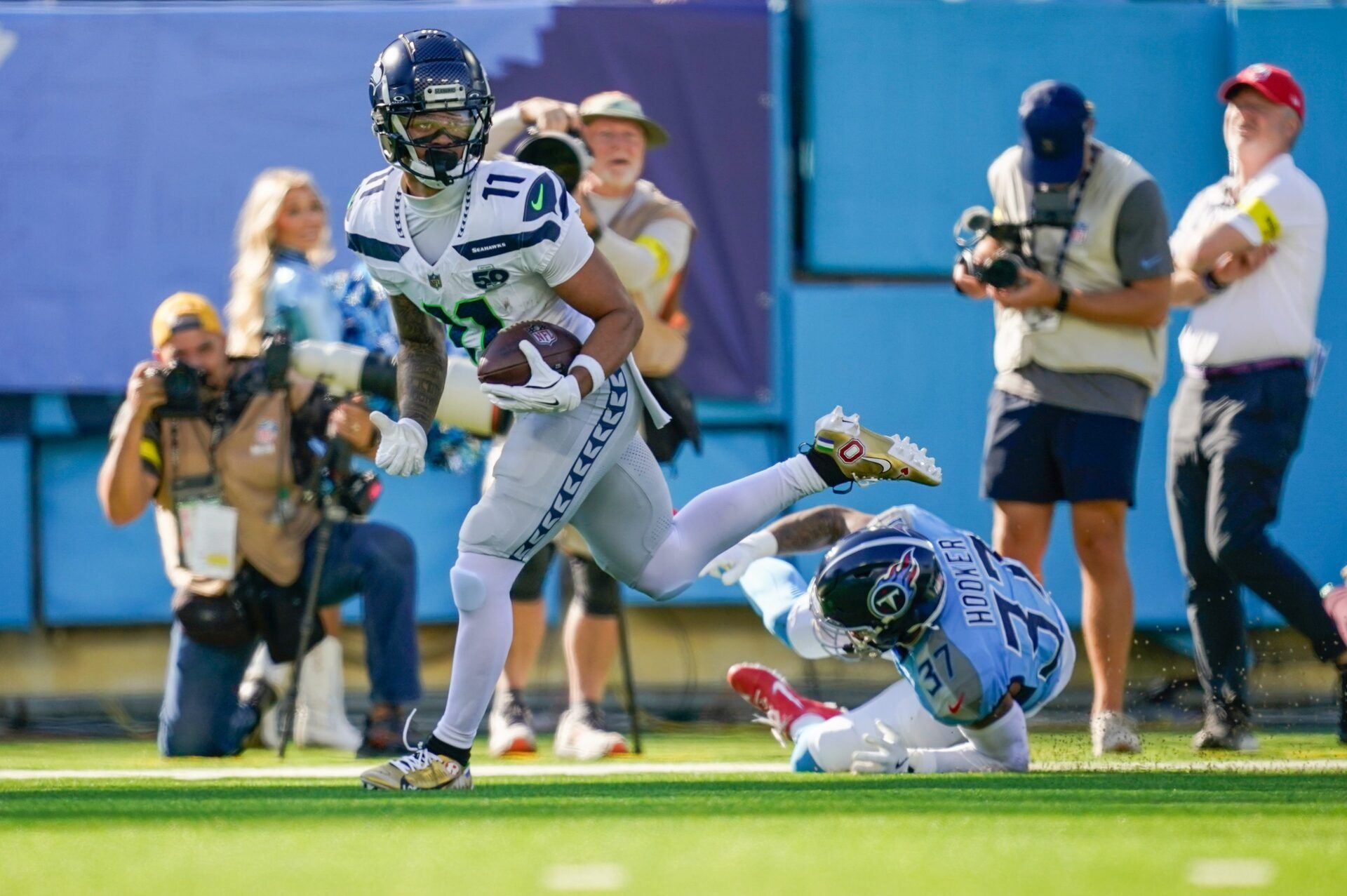 Seattle Seahawks wide receiver Jaxon Smith-Njigba (11) receives a pass for a touchdown in front of Tennessee Titans safety Amani Hooker (37) during the second quarter at Nissan Stadium.