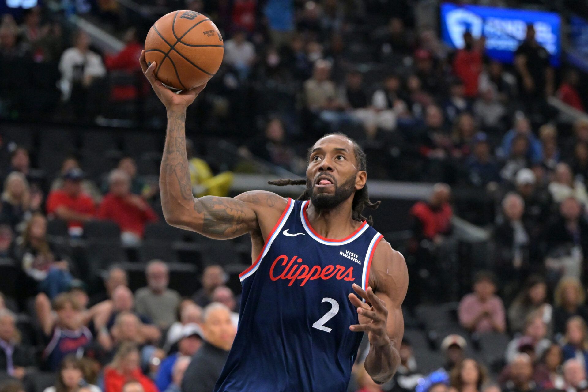 Los Angeles Clippers forward Kawhi Leonard (2) stole the ball from Phoenix Suns guard Collin Gillespie (12) and went down court for a basket in the first half at Intuit Dome.