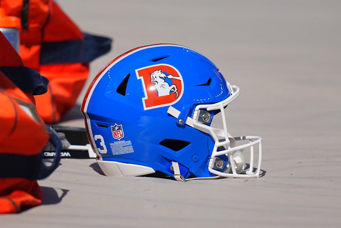 Detailed view of the throw back helmets worn by the Denver Broncos before the game against the Las Vegas Raiders at Empower Field at Mile High.