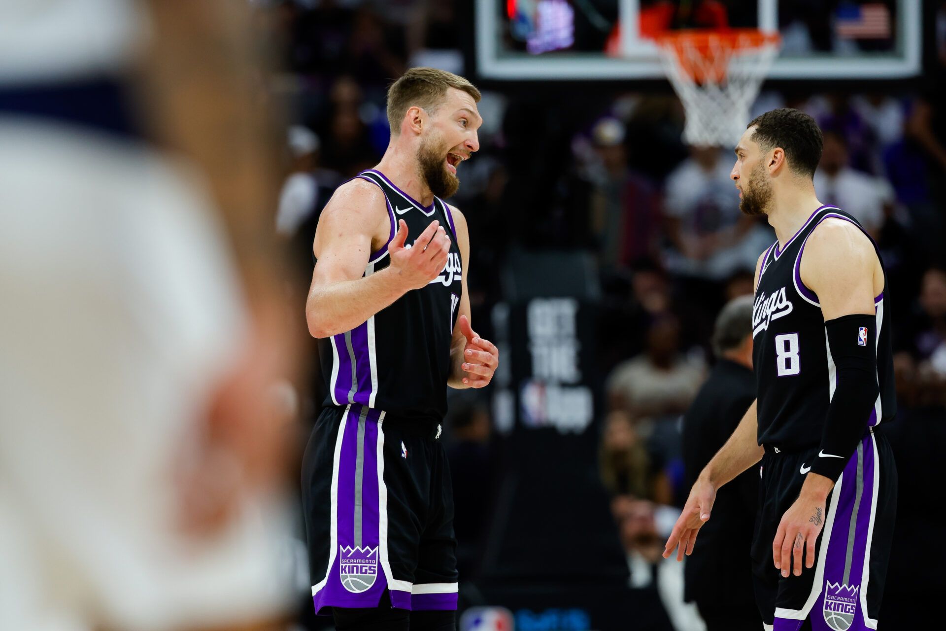 Sacramento Kings forward Domantas Sabonis (11) talks with guard Zach LaVine (8) during the second quarter against the Dallas Mavericks at Golden 1 Center.
