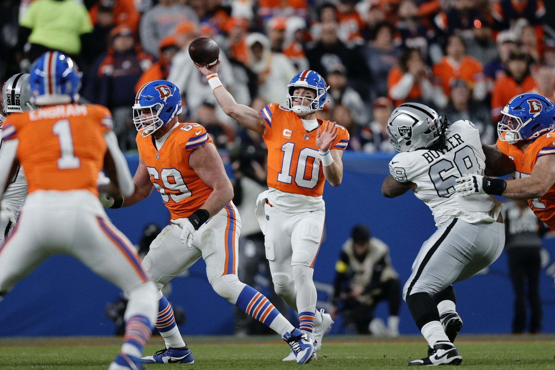 Denver Broncos quarterback Bo Nix (10) drops back to pass against the Las Vegas Raiders during the first half at Empower Field at Mile High.