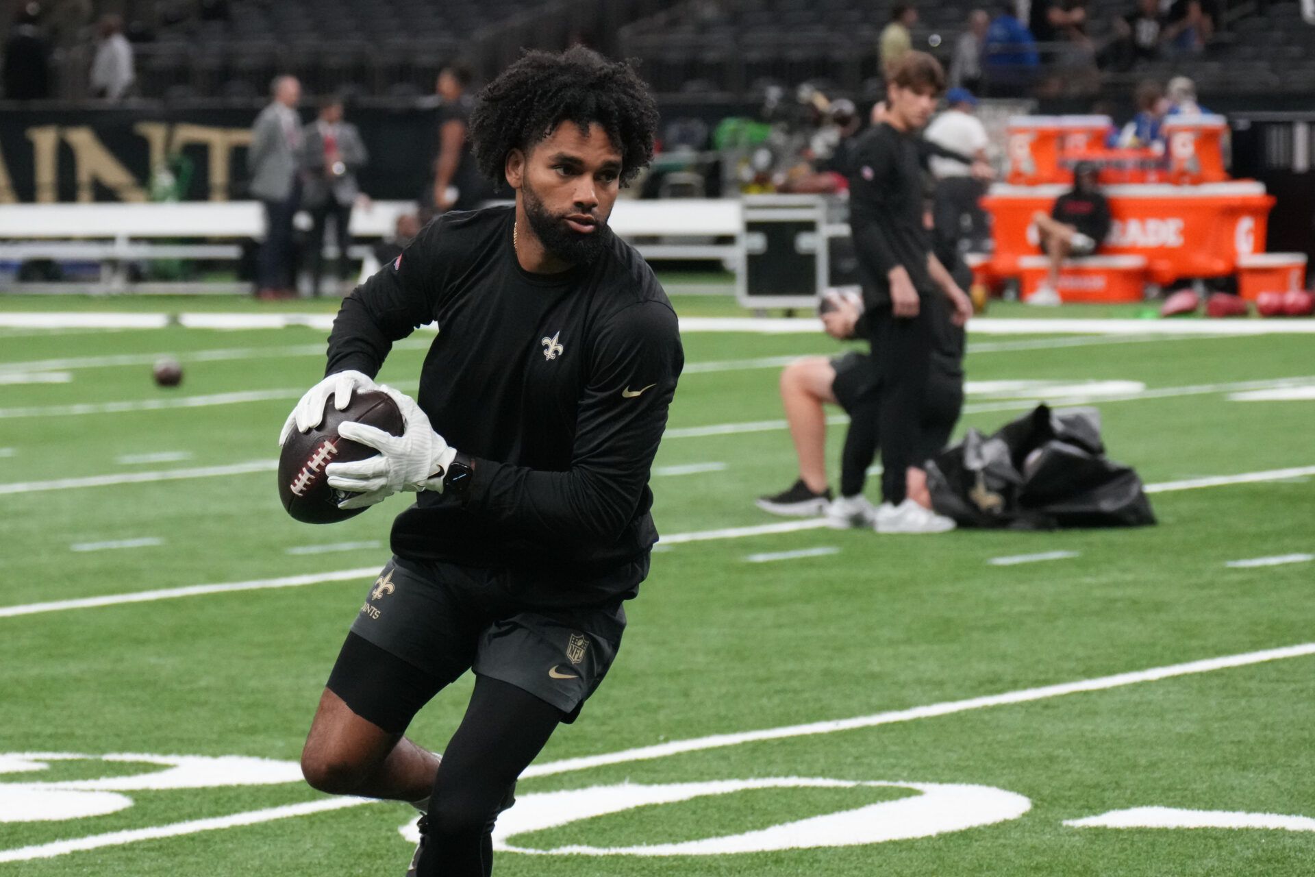 New Orleans Saints wide receiver Chris Olave (12) warms up prior to a game against the Atlanta Falcons at Caesars Superdome.