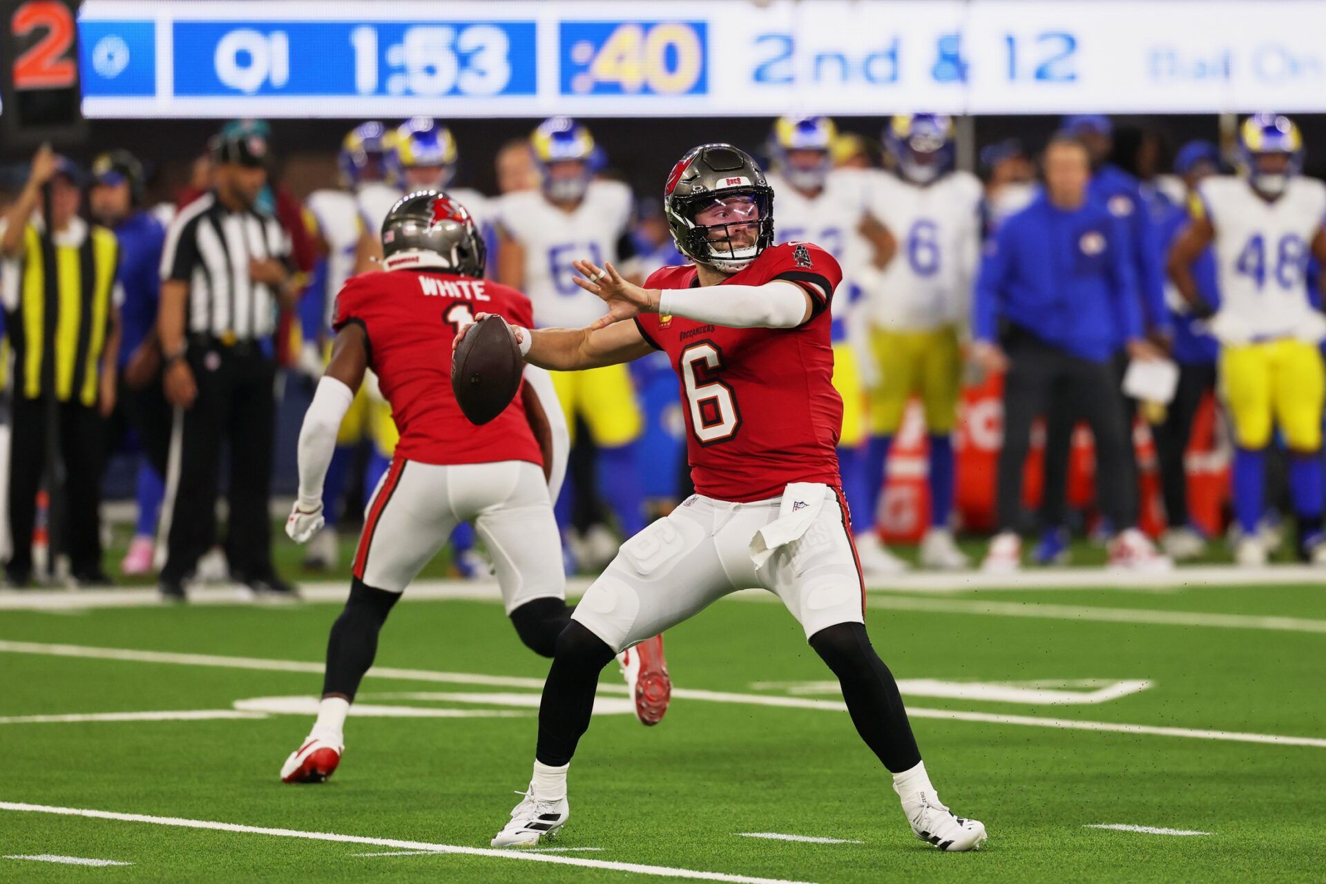 Tampa Bay Buccaneers quarterback Baker Mayfield (6) throws a pass against the Los Angeles Rams during the first quarter at SoFi Stadium.