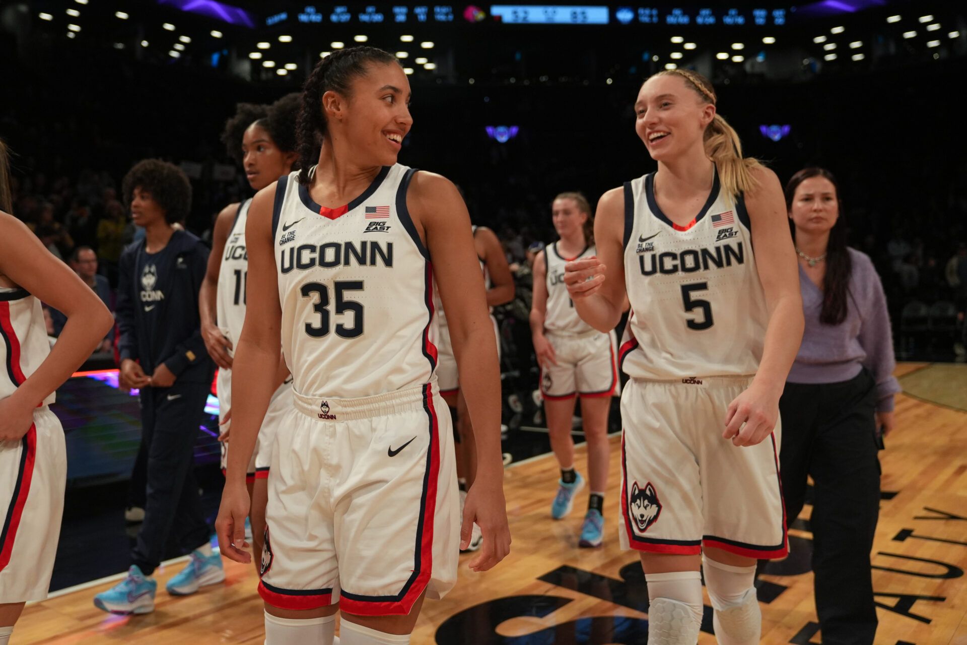 Connecticut Huskies guard Azzi Fudd (35) and Connecticut Huskies guard Paige Bueckers (5) celebrate after the game against the Louisville Cardinals at Barclays Center.