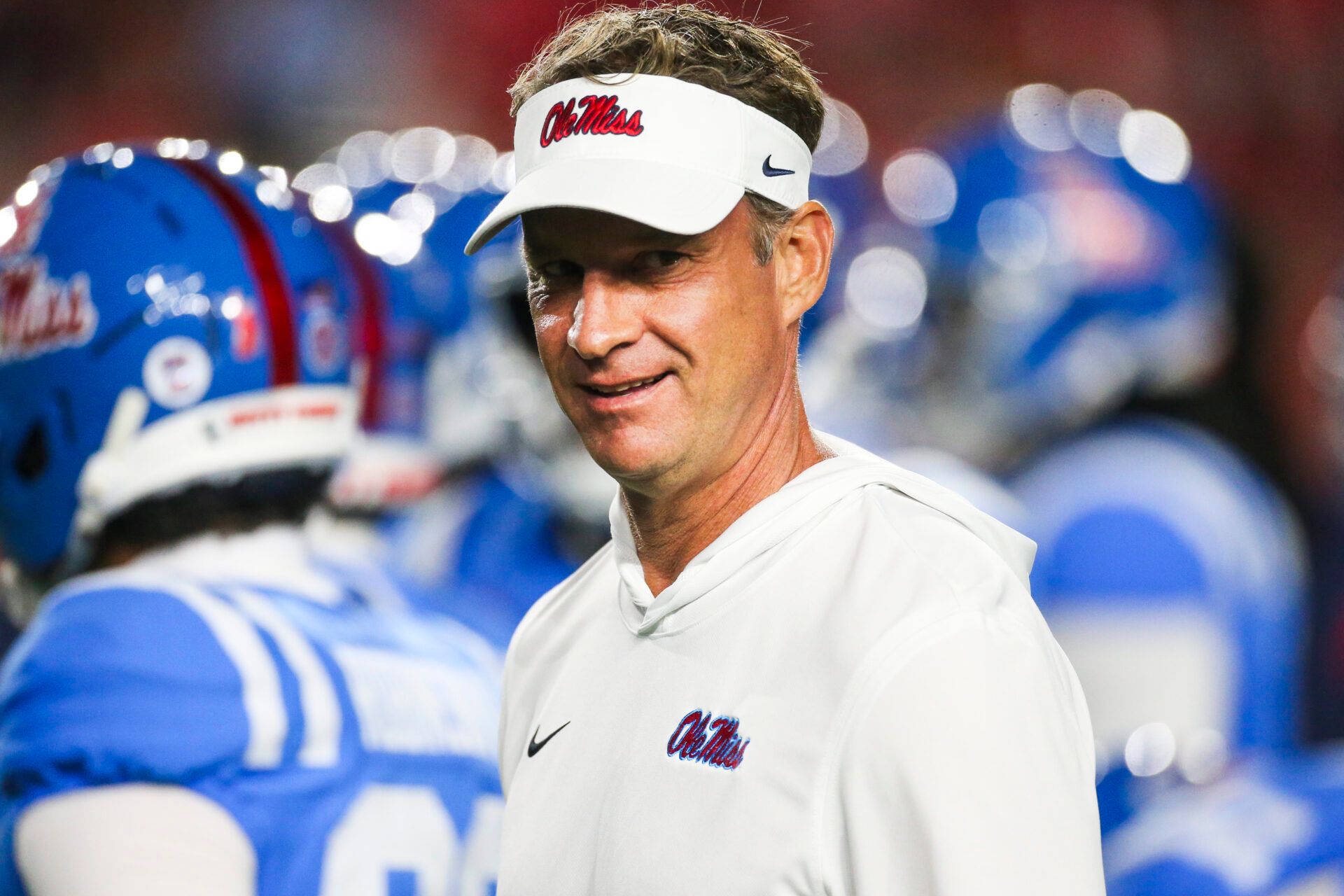Mississippi Rebels head coach Lane Kiffin watches pregame warmups against the Florida Gators at Vaught-Hemingway Stadium.