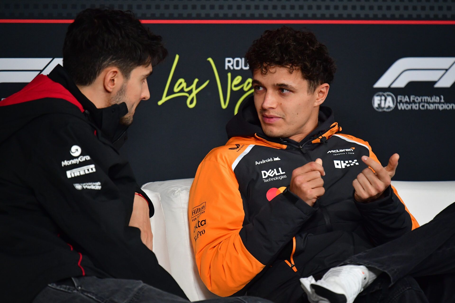Haas F1 Team driver Esteban Ocon (31) speaks with McLaren driver Lando Norris (4) during media availabilities at Las Vegas Strip Circuit.