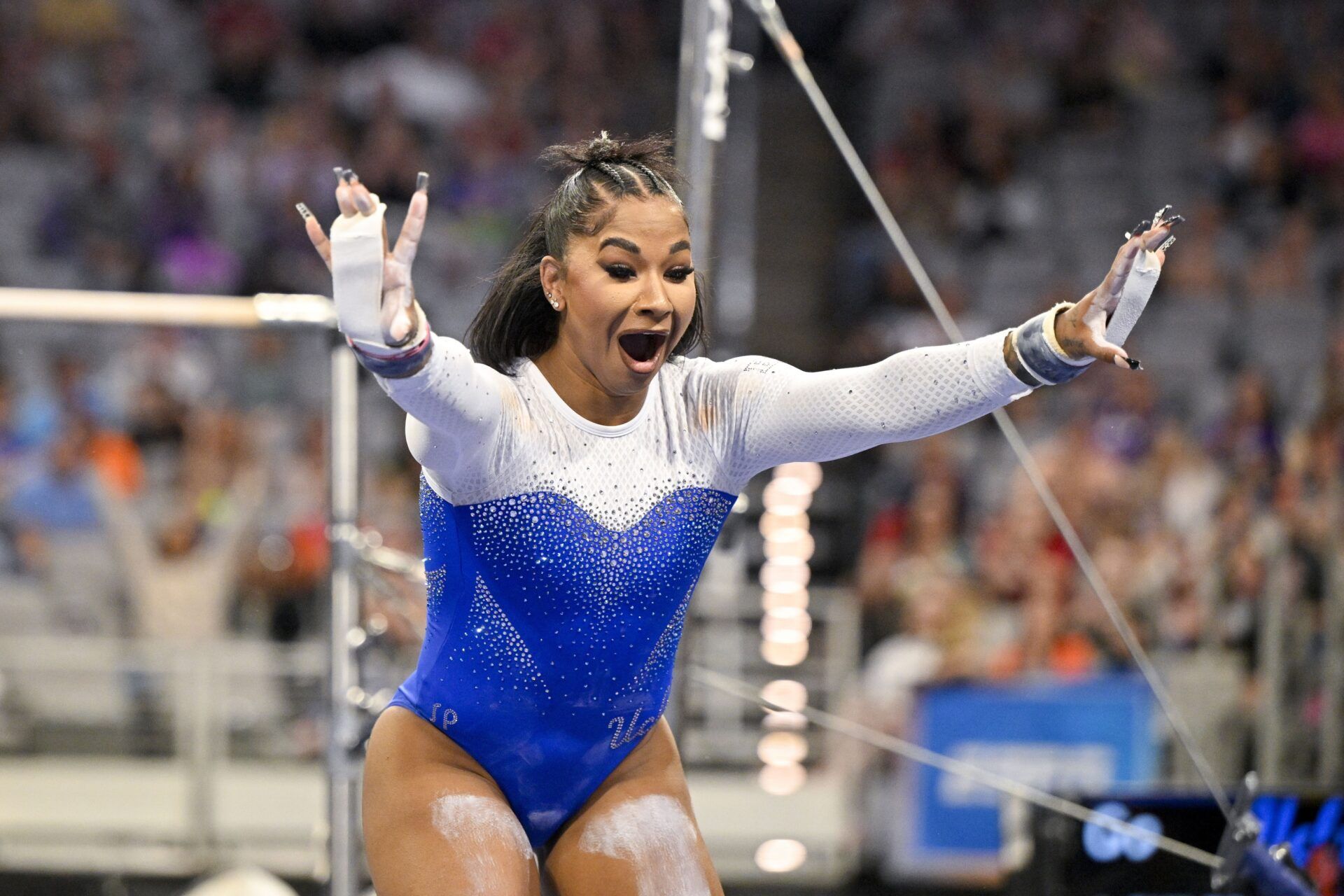 UCLA Bruins gymnast Jordan Chiles performs on uneven bars during the 2025 Women's National Gymnastics Semifinal at Dickies Arena.