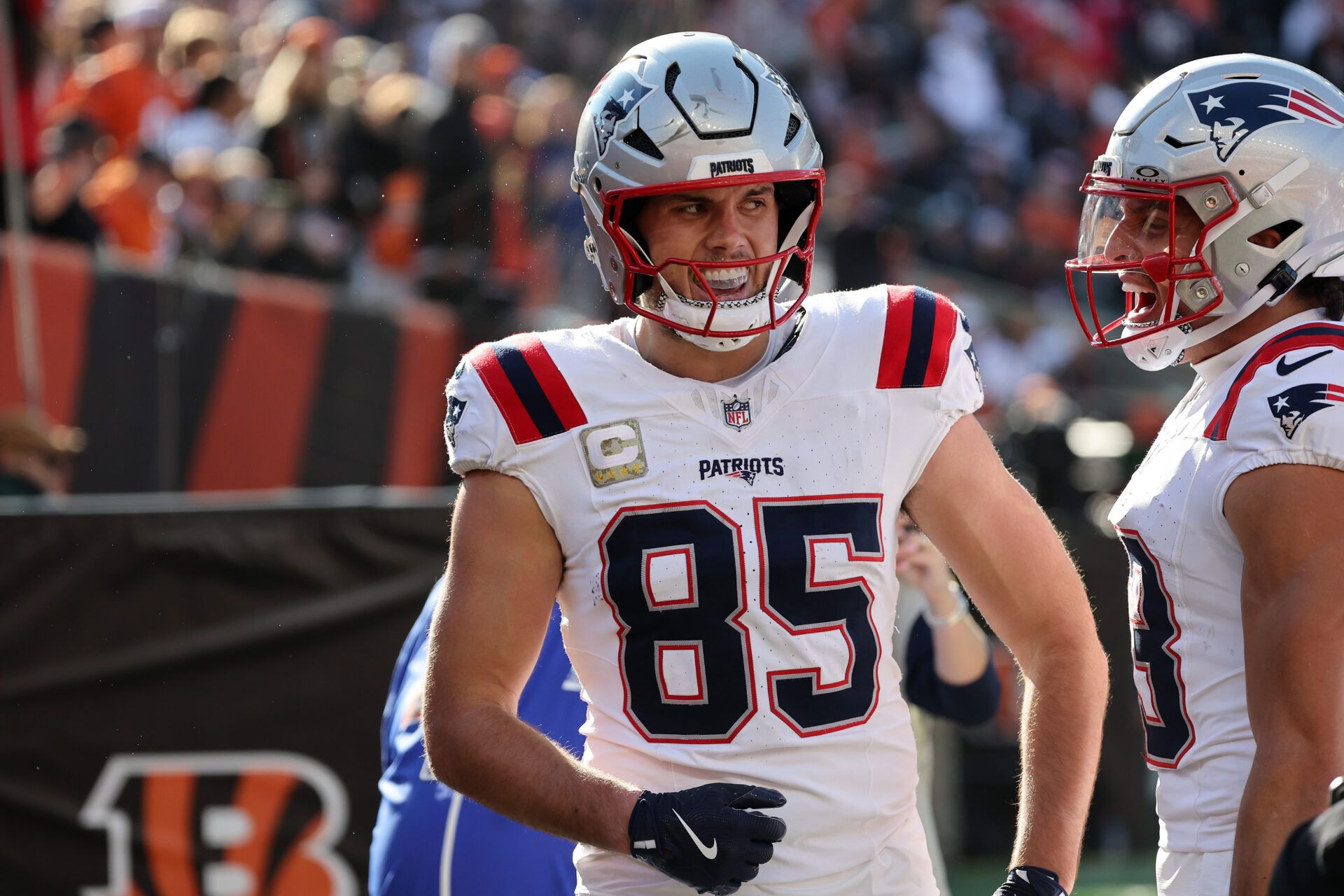 New England Patriots tight end Hunter Henry (85) celebrates with teammates after scoring a touchdown during the first half against the Cincinnati Bengals at Paycor Stadium.