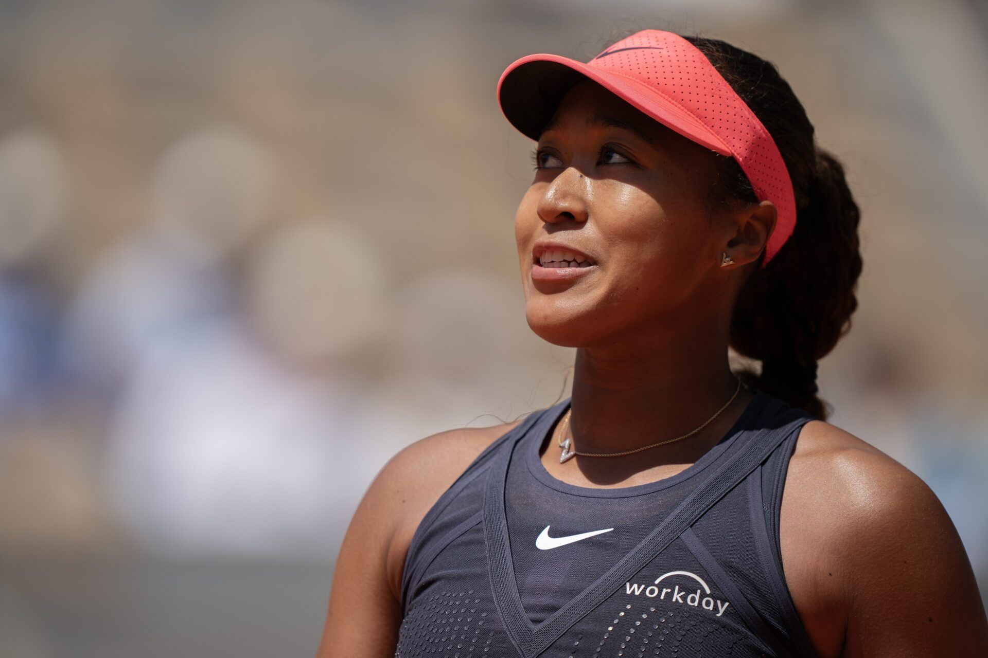 Naomi Osaka of Japan reacts to a point in her first round match against Lucia Bronzetti of Italy on day one of Roland Garros at Stade Roland Garros.