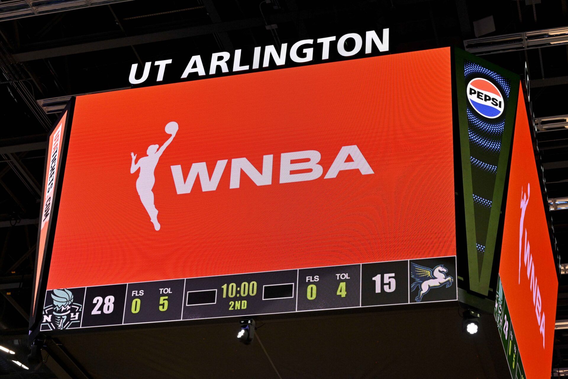 A view of the scoreboard and the WNBA logo as an announcement is made about throwing any toys or objects on to the court during the first half of the game between the Dallas Wings and the New York Liberty at College Park Center.