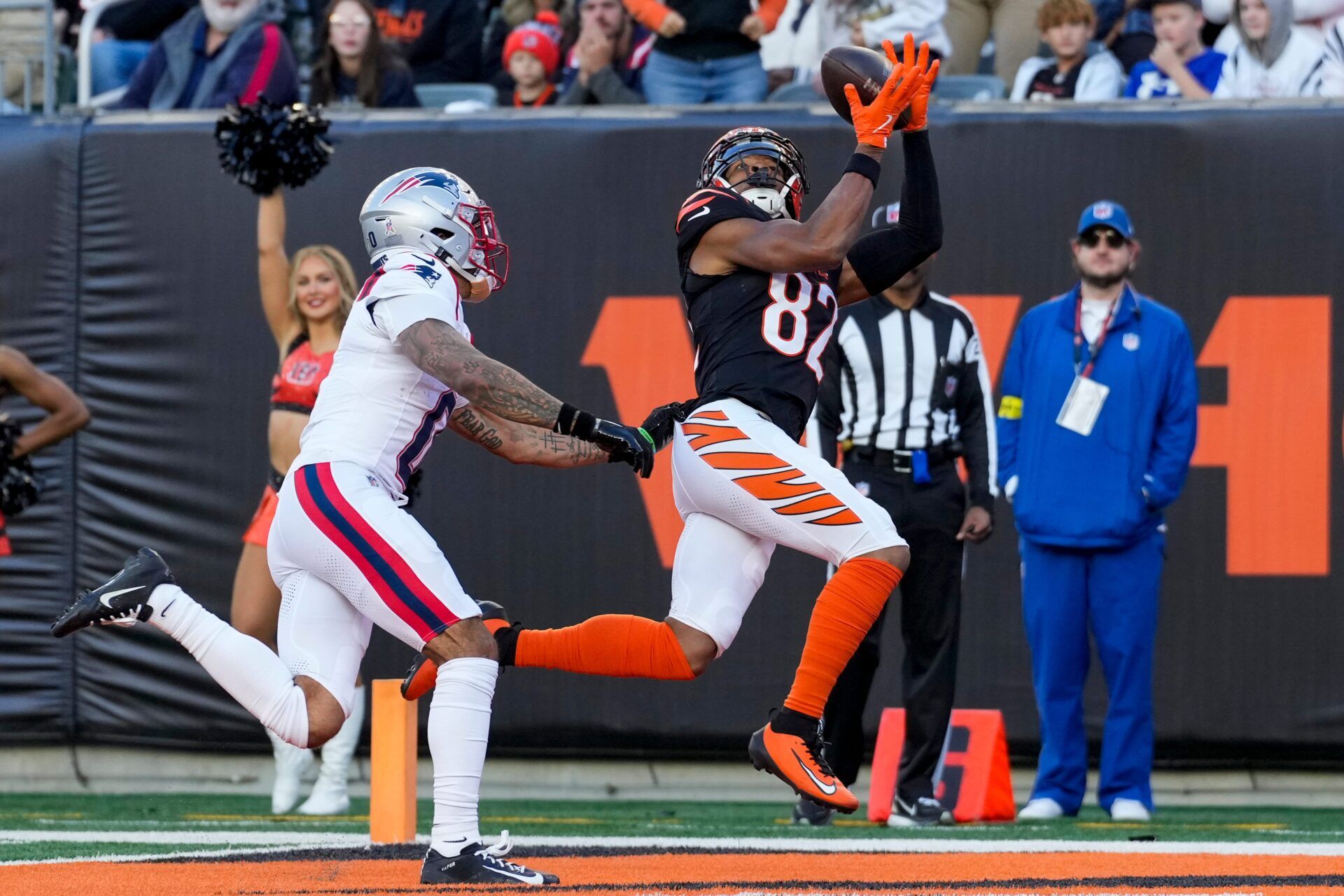 Cincinnati Bengals wide receiver Mitchell Tinsley (82) catches a pass in the end zone for a touchdown in the fourth quarter of the NFL Week 12 game between the Cincinnati Bengals and the New England Patriots at Paycor Stadium in downtown Cincinnati on Sunday, Nov. 23, 2025. The Bengals fall to 3-8 with a 26-20 loss at home.