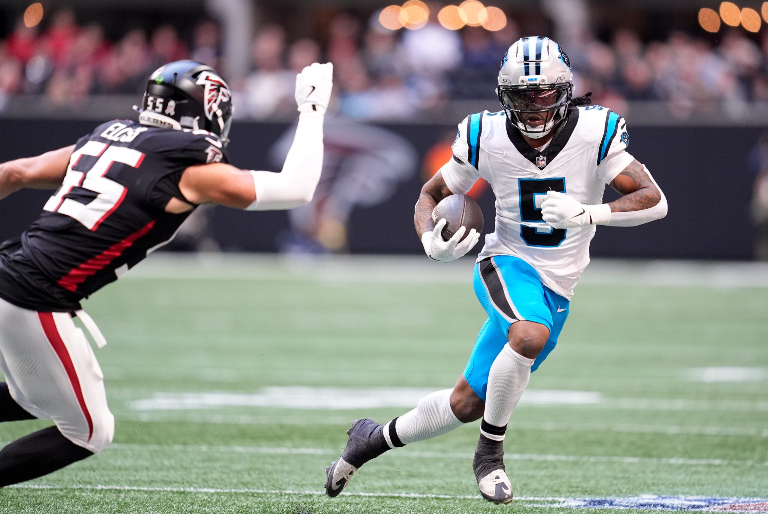 Carolina Panthers running back Rico Dowdle (5) runs with the ball in the first quarter against the Atlanta Falcons at Mercedes-Benz Stadium.