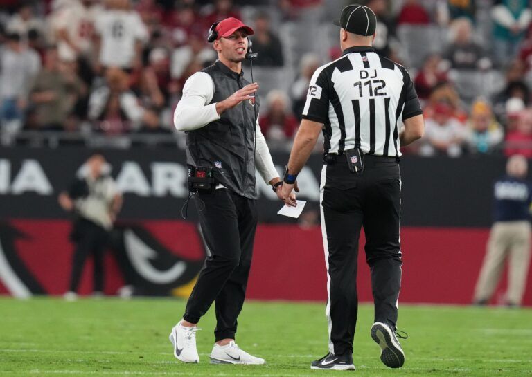 Arizona Cardinals head coach Jonathan Gannon talks to a referee during their game against the Jacksonville Jaguars at State Farm Stadium on Nov. 23, 2025.
