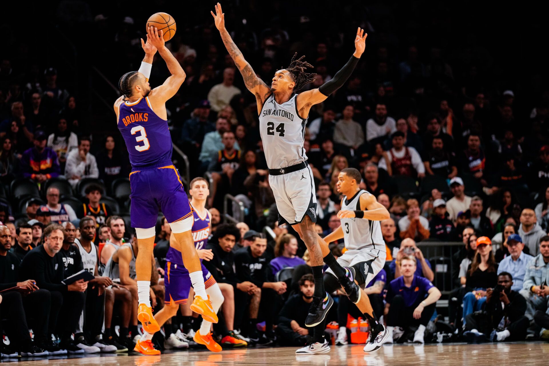 Phoenix Suns forward Dillon Brooks (3) takes a shot against San Antonio Spurs guard Devin Vassell (24)  in the second half of the game at Mortgage Match Up Center.
