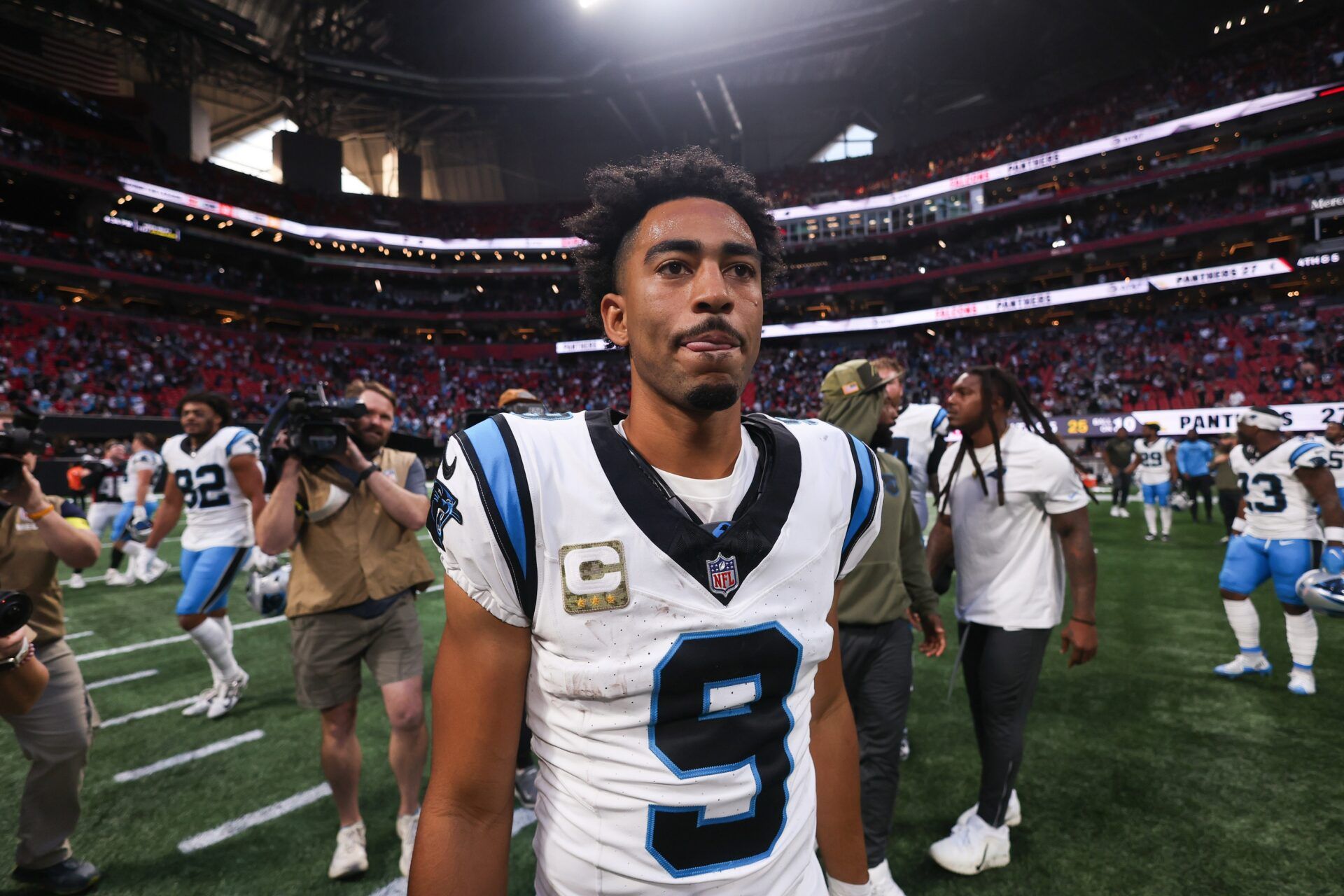 Carolina Panthers quarterback Bryce Young (9) looks on after the game  against the Atlanta Falcons at Mercedes-Benz Stadium.